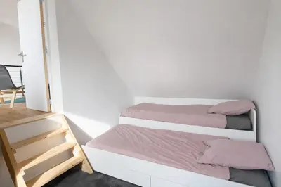 Un ou plusieurs lits dans un hébergement de l'établissement La maison du Golf