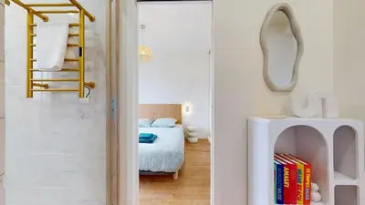 Un ou plusieurs lits dans un hébergement de l'établissement Vue sur le Port de Caen Appartement Premium