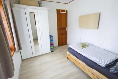 Un ou plusieurs lits dans un hébergement de l'établissement Modernes Landhaus mit großem Garten