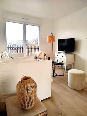 Télévision ou salle de divertissement dans l'établissement Le Riva