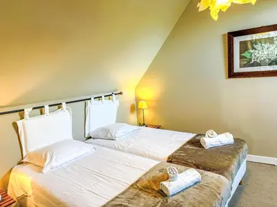 Un ou plusieurs lits dans un hébergement de l'établissement Apartment Gîte La Cormorandière by Interhome