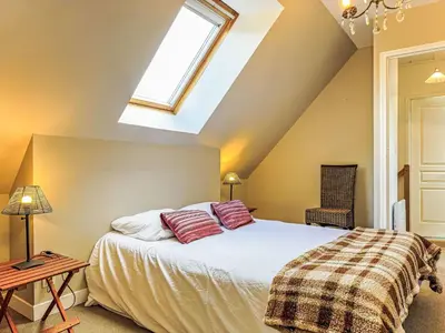 Un ou plusieurs lits dans un hébergement de l'établissement Apartment Gîte Le Bisquin by Interhome