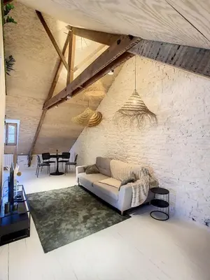 Un ou plusieurs lits dans un hébergement de l'établissement Appartement de charme, plein centre de Cancale