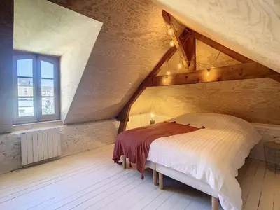 Un ou plusieurs lits dans un hébergement de l'établissement Appartement de charme, plein centre de Cancale