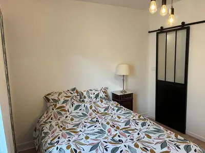 Un ou plusieurs lits dans un hébergement de l'établissement Logement paisible dans une jolie cour intérieure