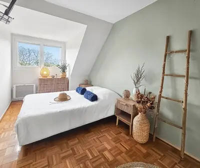 Un ou plusieurs lits dans un hébergement de l'établissement F2 chic 100 m de la mer Balcon Sud Ouest