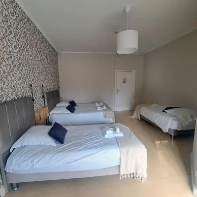 Un ou plusieurs lits dans un hébergement de l'établissement Eco Hôtel du Domaine de Ouézy