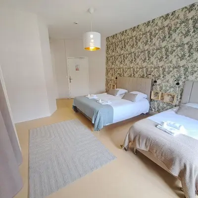 Un ou plusieurs lits dans un hébergement de l'établissement Eco Hôtel du Domaine de Ouézy