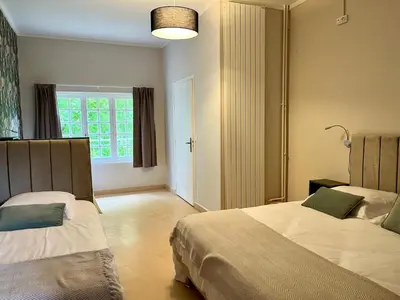 Un ou plusieurs lits dans un hébergement de l'établissement Eco Hôtel du Domaine de Ouézy