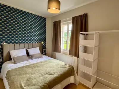 Un ou plusieurs lits dans un hébergement de l'établissement Eco Hôtel du Domaine de Ouézy