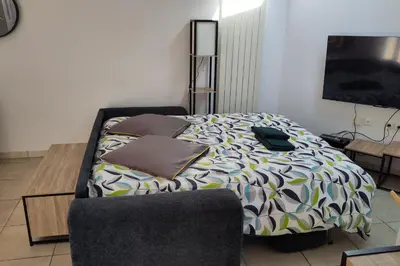 Un ou plusieurs lits dans un hébergement de l'établissement Maison lumineuse avec terrasse et jardin - Caen