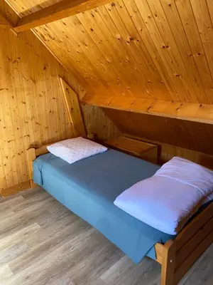 Un ou plusieurs lits dans un hébergement de l'établissement Petit chalet