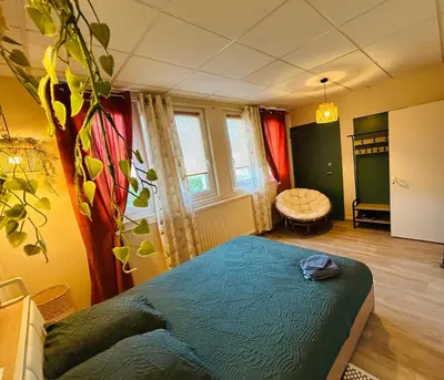 Coin salon dans l'établissement Espace Familiale Meublé 3 chambres