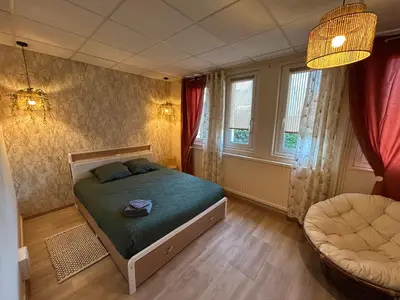 Un ou plusieurs lits dans un hébergement de l'établissement Espace Familiale Meublé 3 chambres