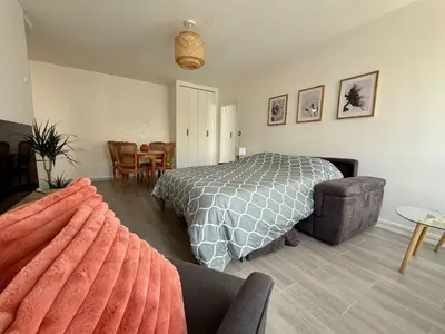 Coin salon dans l'établissement Appartement lumineux avec balcon