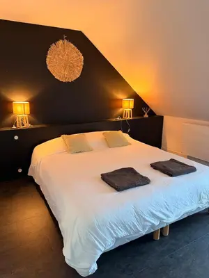 Un ou plusieurs lits dans un hébergement de l'établissement Granville appartement