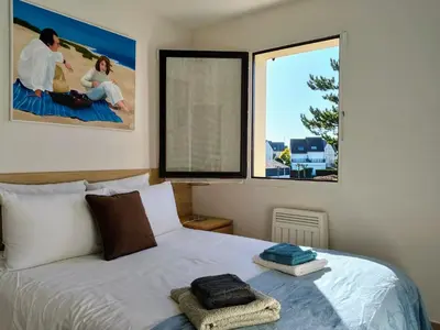 Un ou plusieurs lits dans un hébergement de l'établissement Agréable appartement 2 chambres, balcon, calme et soleil