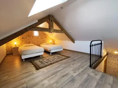 Un ou plusieurs lits dans un hébergement de l'établissement Omaha Secret Normandy Cottages