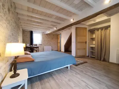 Un ou plusieurs lits dans un hébergement de l'établissement Omaha Secret Normandy Cottages