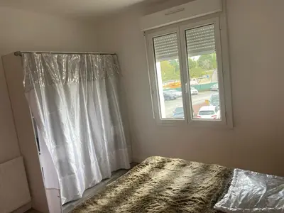 Un ou plusieurs lits dans un hébergement de l'établissement Maison de ville mitoyenne 4 chambres