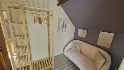 Coin salon dans l'établissement Gîte le petit Hérils