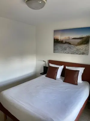 Un ou plusieurs lits dans un hébergement de l'établissement Brit Hotel Cherbourg