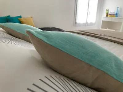 Un ou plusieurs lits dans un hébergement de l'établissement Maison Mama Neko