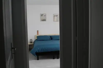 Un ou plusieurs lits dans un hébergement de l'établissement Maison Mama Neko