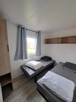 Un ou plusieurs lits dans un hébergement de l'établissement Camping Sainte Mère Eglise