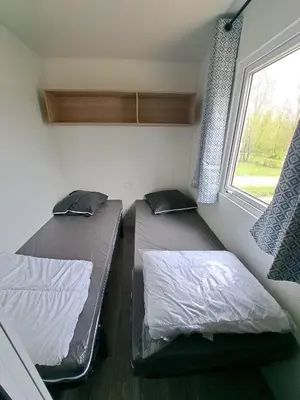 Un ou plusieurs lits dans un hébergement de l'établissement Camping Sainte Mère Eglise