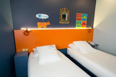 Un ou plusieurs lits dans un hébergement de l'établissement Hotel Gabriel