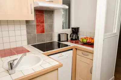 Cuisine ou kitchenette dans l'établissement Villa Republique Normandie Liberté