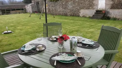 Jardin de l'établissement Chambres de Charme a la Ferme