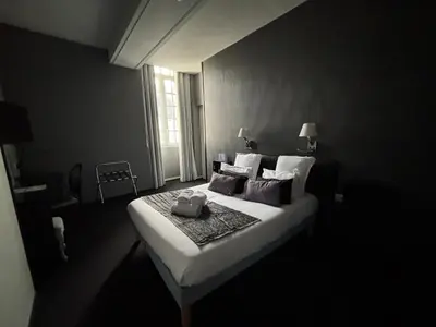 Un ou plusieurs lits dans un hébergement de l'établissement Hôtel - Restaurant Eugenie