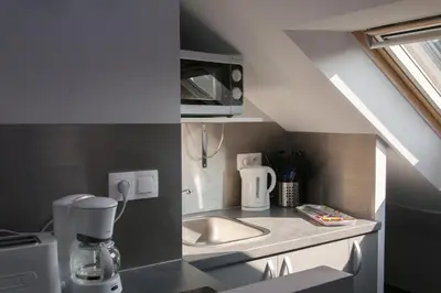 Cuisine ou kitchenette dans l'établissement Smartappart Caen Grusse