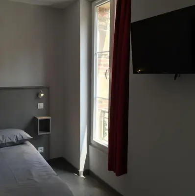 Un ou plusieurs lits dans un hébergement de l'établissement Smartappart Caen Grusse