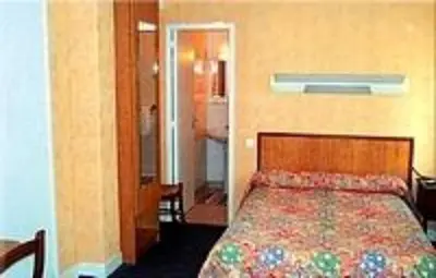Un ou plusieurs lits dans un hébergement de l'établissement Le Clos Normand