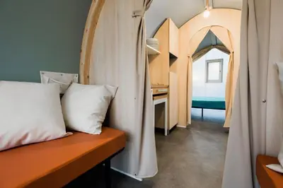 Un ou plusieurs lits dans un hébergement de l'établissement O2 Camping