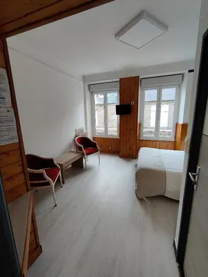 Un ou plusieurs lits dans un hébergement de l'établissement Hôtel Saint - Pierre