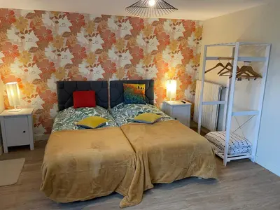 Un ou plusieurs lits dans un hébergement de l'établissement La Villa Port Winston - Face Mer Chambres & Studios