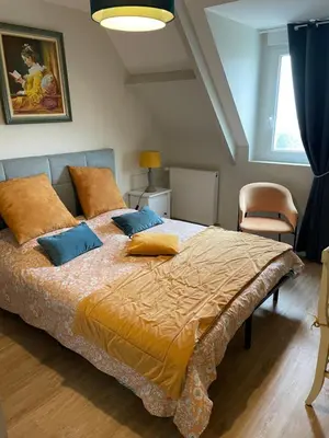 Un ou plusieurs lits dans un hébergement de l'établissement La Villa Port Winston - Face Mer Chambres & Studios