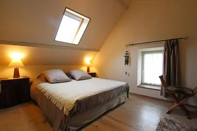 Un ou plusieurs lits dans un hébergement de l'établissement Gites Du Manoir de Savigny