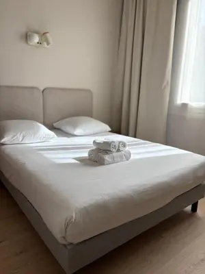 Un ou plusieurs lits dans un hébergement de l'établissement Hotel Bloom