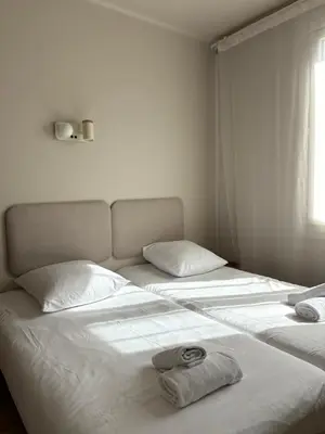 Un ou plusieurs lits dans un hébergement de l'établissement Hotel Bloom