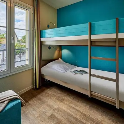 Un ou plusieurs lits dans un hébergement de l'établissement Residence Port Guillaume - maeva Home