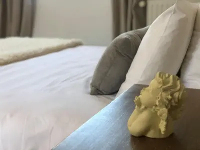 Un ou plusieurs lits dans un hébergement de l'établissement Le Clos de la Barre - Maison de charme au calme -à 10 min des plages du Débarquement - petit-déjeuner maison