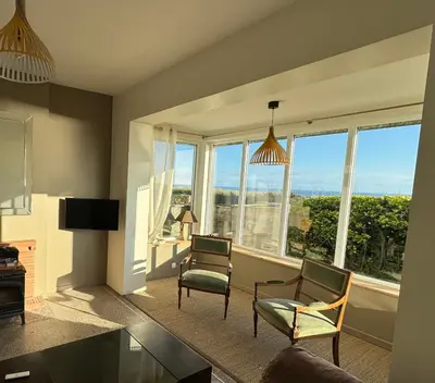 Coin salon dans l'établissement Villa Denise Grand Gîte