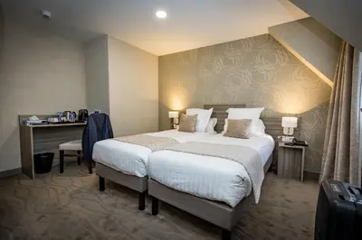 Un ou plusieurs lits dans un hébergement de l'établissement Hôtel De Brunville & Spa