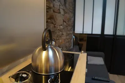 Cuisine ou kitchenette dans l'établissement L'atelier
