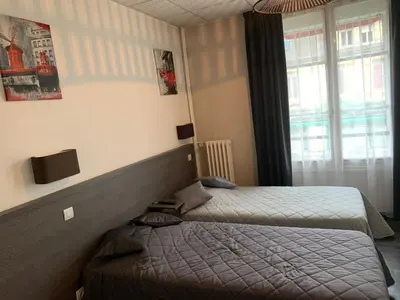 Un ou plusieurs lits dans un hébergement de l'établissement Au Vieux Puits